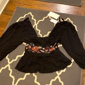 Brand new! Long sleeved crop top.